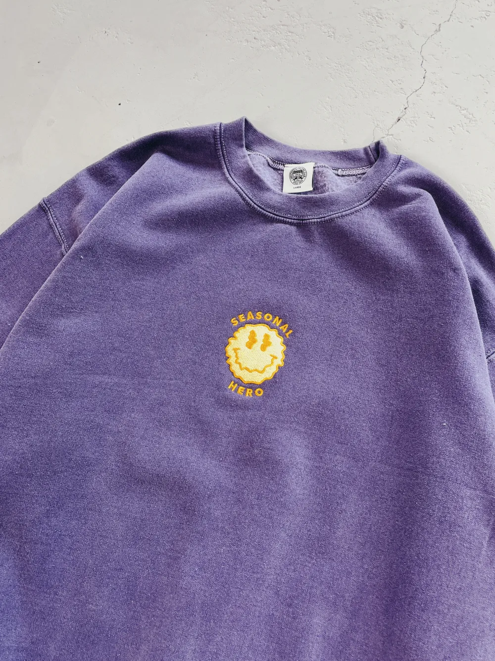 Seasonal Hero 'Trippy Smiler' Embroidered Vintage Washed Sweater - Violet